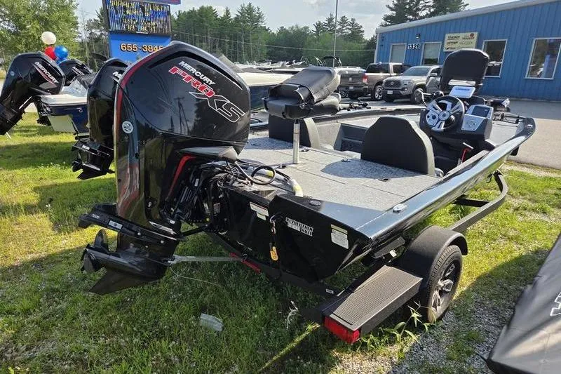 Slide: The Image of 2026 Tracker PT 195 TXW TE boat with Mercury Pro XS engine on display outdoors. - 8