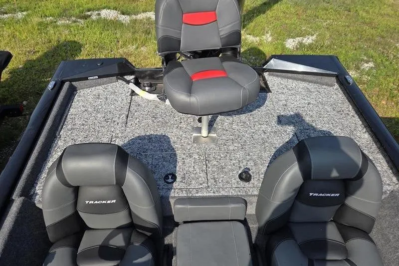 Slide: The Image of 2026 Tracker PT 195 TXW TE boat interior with gray and red seating. - 9