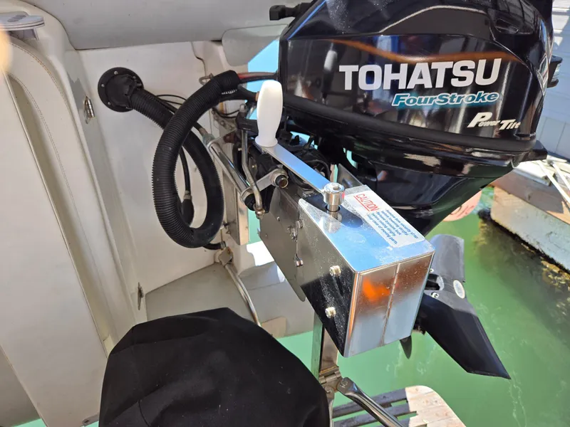 Slide: The Image of Tohatsu FourStroke outboard motor on a 1990 Grand Banks 36 Europa boat. - 22