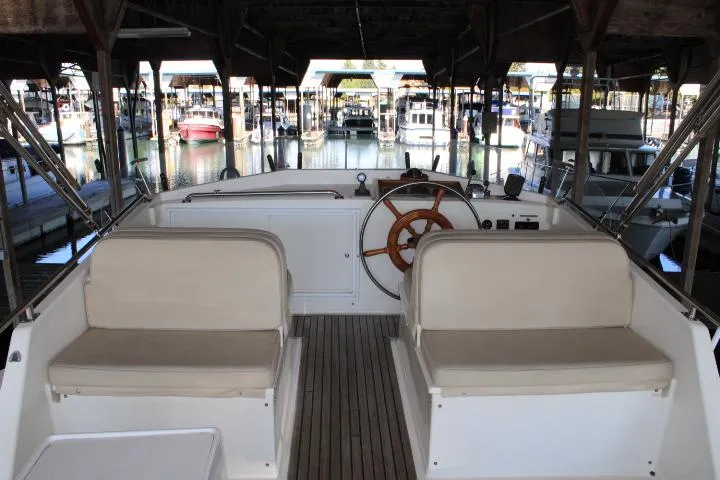 Slide: The Image of Interior view of 1990 Grand Banks 36 Europa yacht with helm and seating. - 26