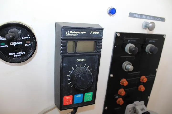 Slide: The Image of Control panel of a 1990 Grand Banks 36 Europa with Robertson F200 autopilot. - 31