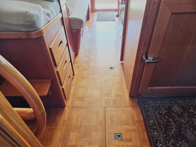 Slide: The Image of Interior of 1990 Grand Banks 36 Europa yacht with wooden flooring and cabinetry. - 46