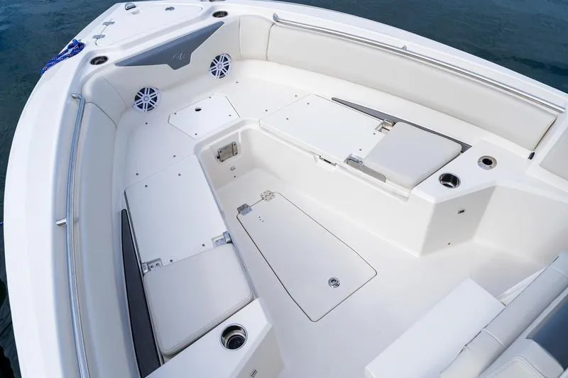 Slide: The Image of 2026 Sailfish 232 CC boat interior with white seating and storage compartments. - 25