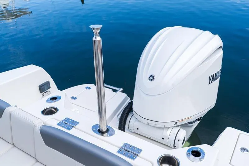 Slide: The Image of 2026 Sailfish 232 CC boat with Yamaha outboard motor on calm water. - 30