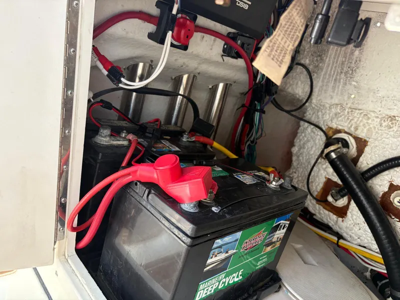 Slide: The Image of Battery compartment of 2019 BlackJack 224 boat with wiring and deep cycle battery. - 10
