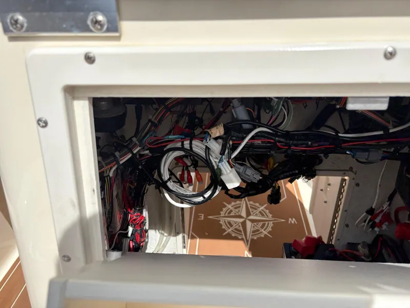 Slide: The Image of Interior wiring of a 2019 BlackJack 224 boat, showcasing complex electrical connections. - 11