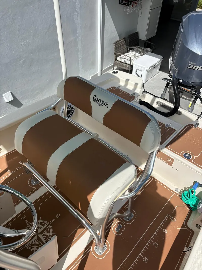 Slide: The Image of Brown and white seating on a 2019 BlackJack 224 boat with Yamaha 300 engine. - 14