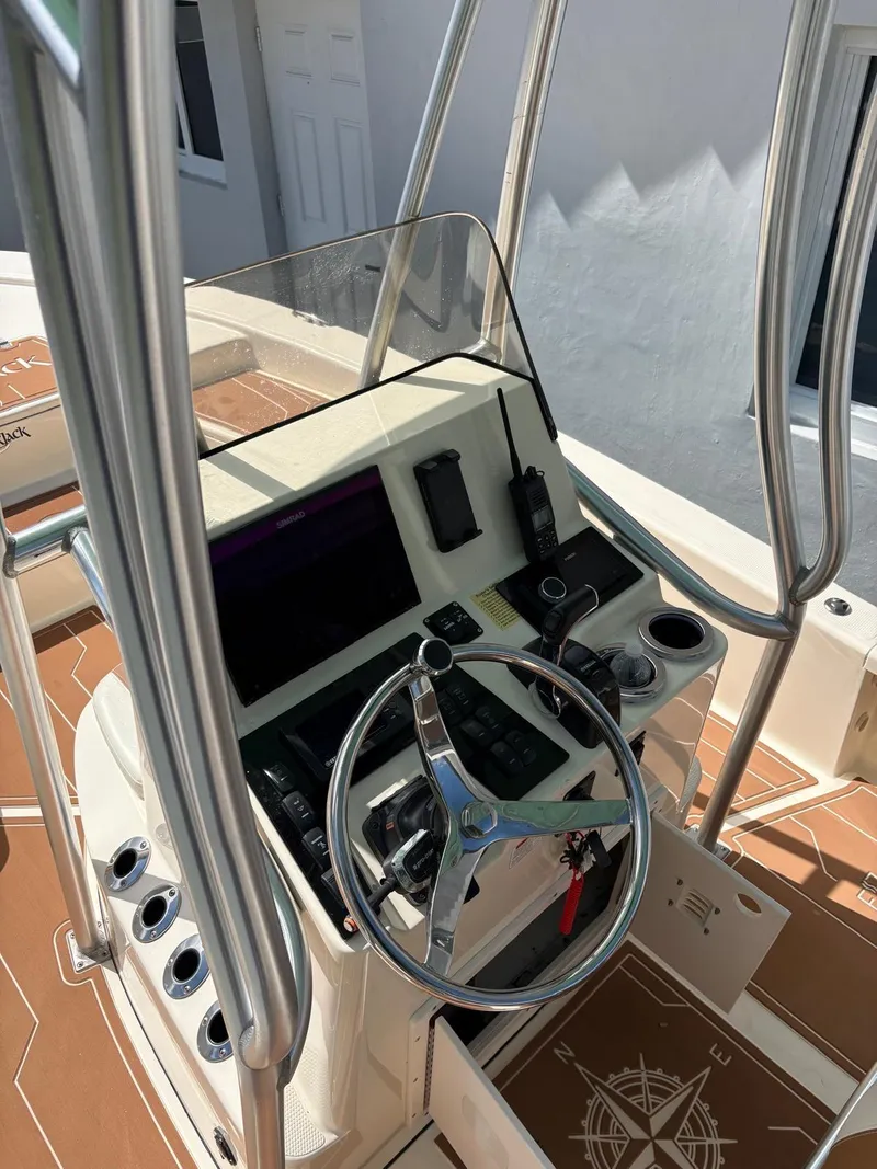 Slide: The Image of Steering console of a 2019 BlackJack 224 boat with navigation equipment. - 15