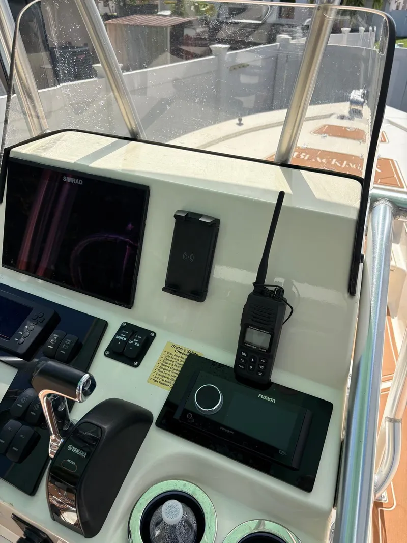 Slide: The Image of Control panel of a 2019 BlackJack 224 boat with navigation and communication equipment. - 16