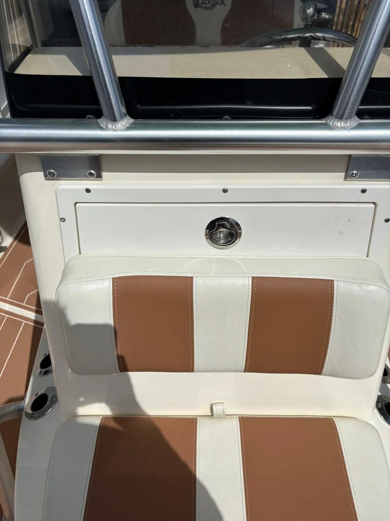 Slide: The Image of 2019 BlackJack 224 boat seat with brown and white upholstery. - 27