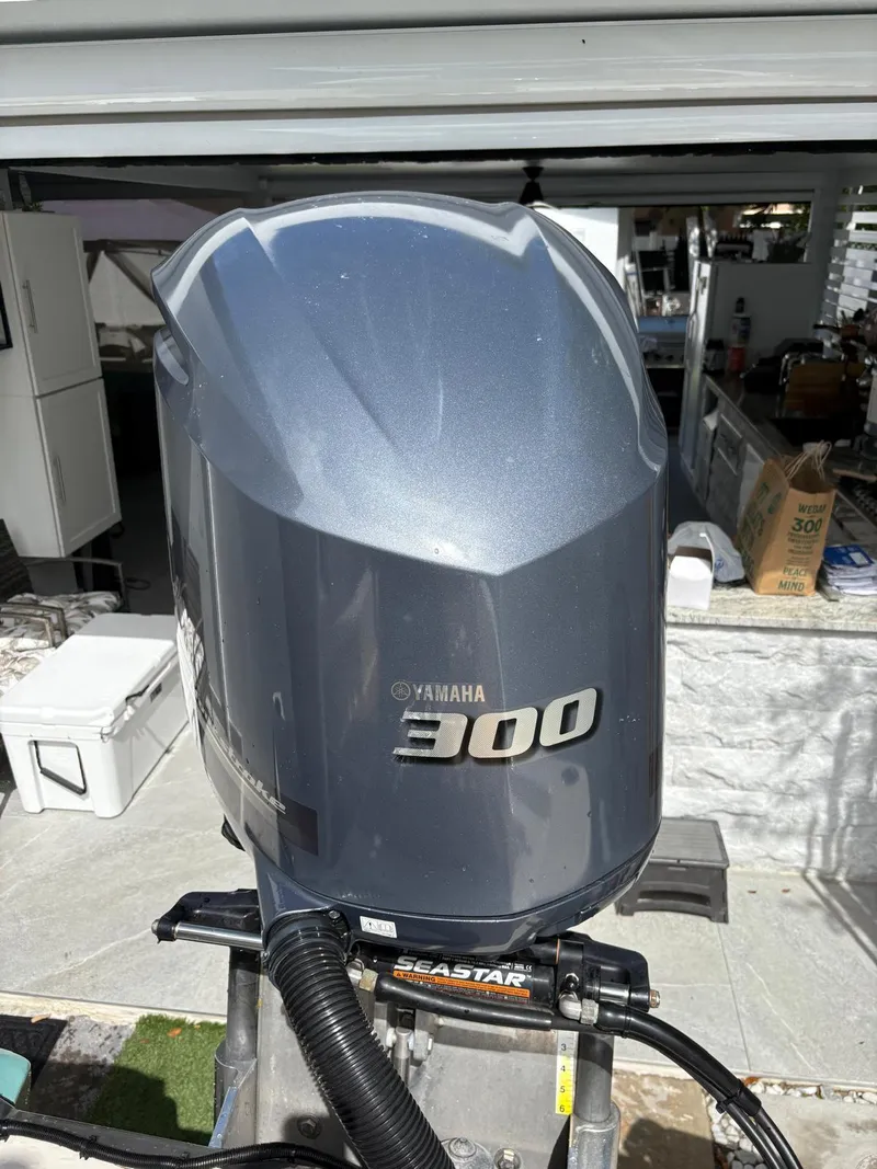 Slide: The Image of Yamaha 300 outboard motor on BlackJack 224, 2019 model, in a garage setting. - 3