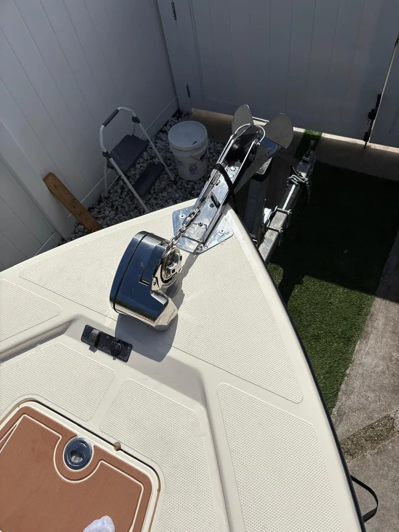 Slide: The Image of Bow of a 2019 BlackJack 224 boat with anchor and deck details. - 33