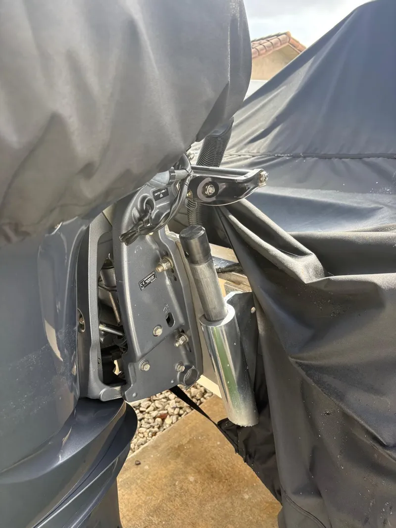 Slide: The Image of Close-up of a 2019 BlackJack 224 boat motor covered with a protective tarp. - 42