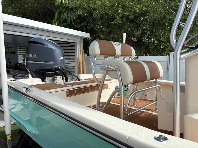 Slide: The Image of 2019 BlackJack 224 boat with Yamaha engine, featuring brown and white seating. - 5