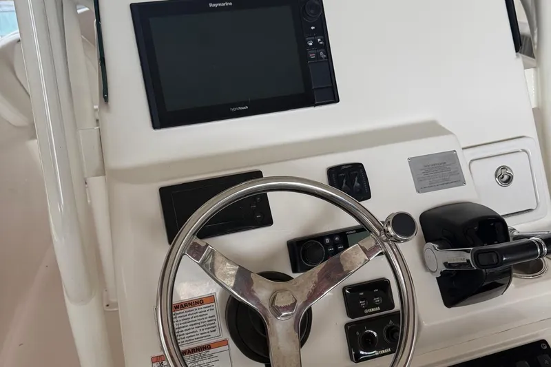 Slide: The Image of Control panel of a 2017 Century 2600 Center Console boat, featuring engine and battery meters. - 10