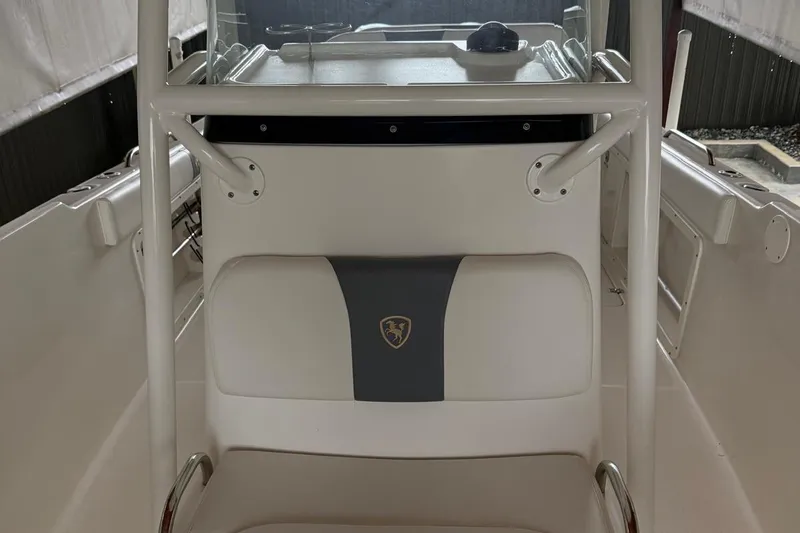 Slide: The Image of Century 2600 Center Console 2017 boat dashboard with steering wheel and controls. - 15