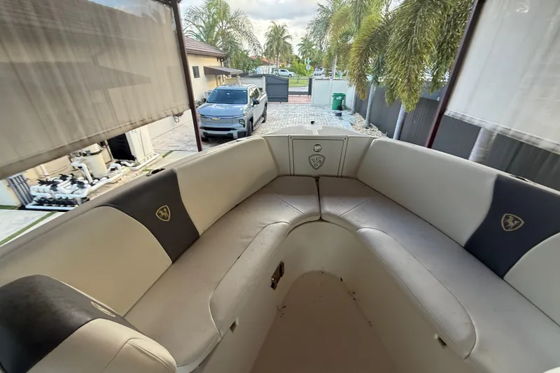 Slide: The Image of 2017 Century 2600 Center Console boat under a covered dock. - 19