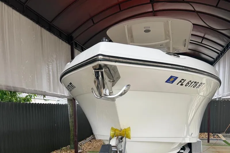 Slide: The Image of 2017 Century 2600 Center Console boat interior with cushioned seating and open deck. - 22