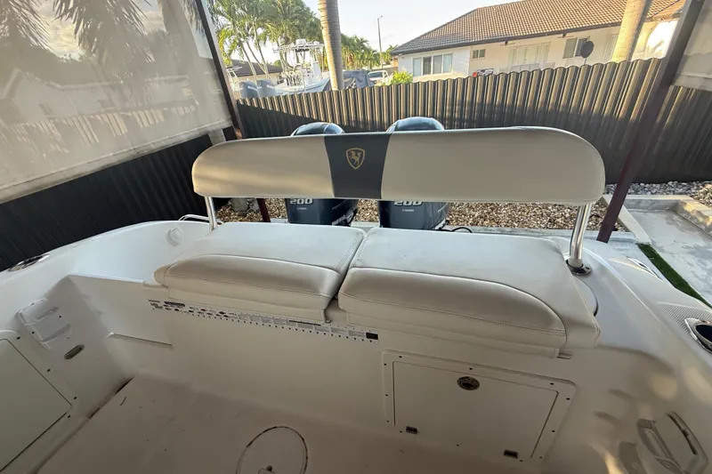 Slide: The Image of 2017 Century 2600 Center Console boat under canopy, featuring spacious seating and modern controls. - 5