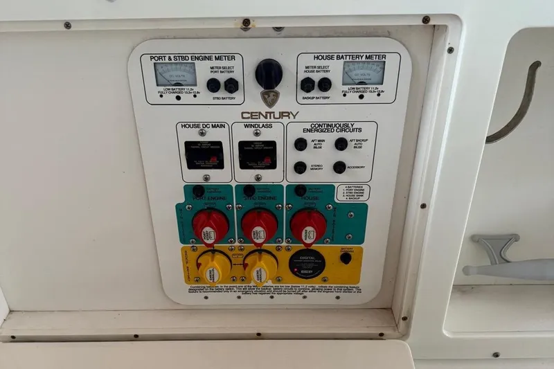 Slide: The Image of 2017 Century 2600 Center Console boat interior with white seating and steering wheel. - 9