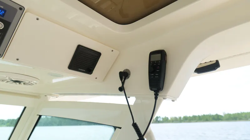 Slide: The Image of Interior of 2022 Scout 330 LXF boat with Garmin marine radio equipment. - 20