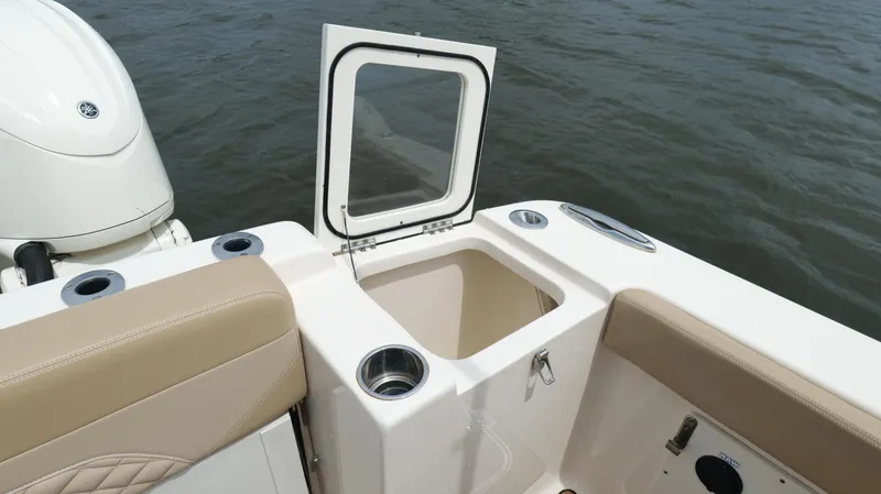 Slide: The Image of 2022 Scout 330 LXF boat interior with open storage compartment. - 31