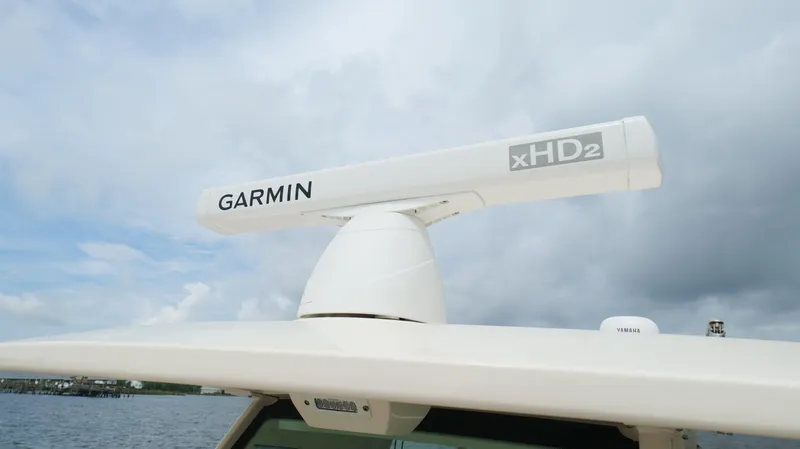 Slide: The Image of Garmin xHD2 radar on 2022 Scout 330 LXF boat under cloudy sky. - 49
