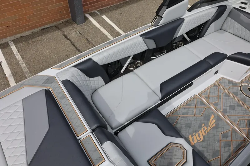 Slide: The Image of 2025 Tigé Z3 boat interior with luxurious seating and stylish design elements. - 12