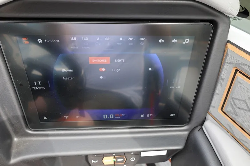 Slide: The Image of 2025 Tigé Z3 boat touchscreen display showing control settings and switches. - 17