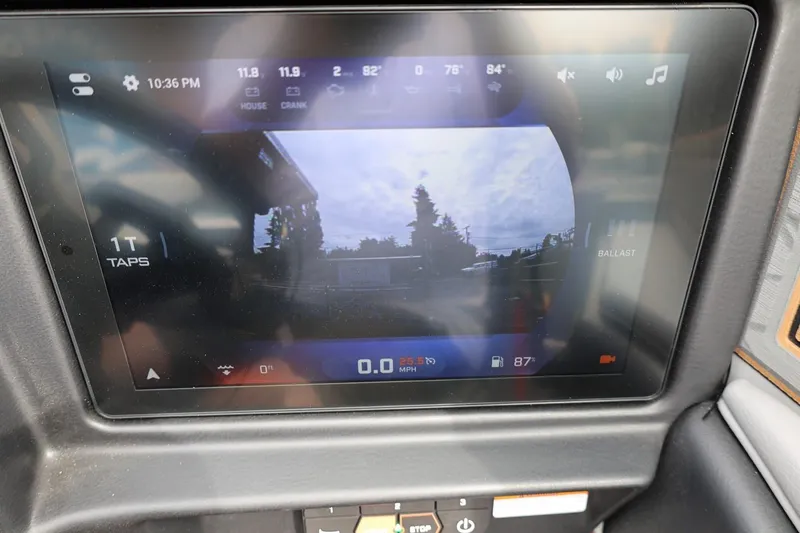 Slide: The Image of 2025 Tigé Z3 dashboard display showing rearview camera and control settings. - 19