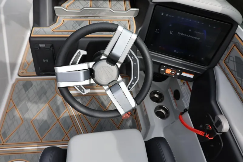 Slide: The Image of 2025 Tigé Z3 boat cockpit with modern steering wheel and touchscreen display. - 21