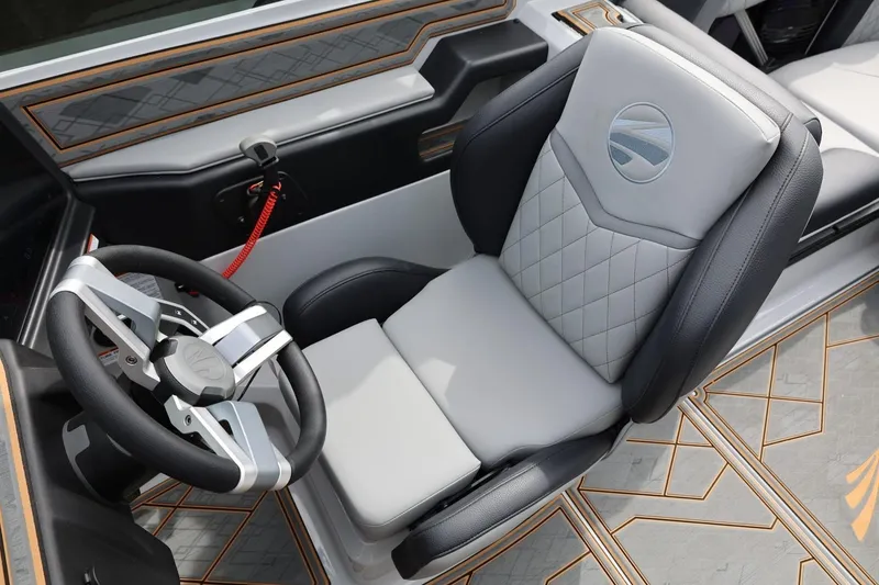 Slide: The Image of 2025 Tigé Z3 boat interior with luxury steering wheel and quilted seat design. - 22