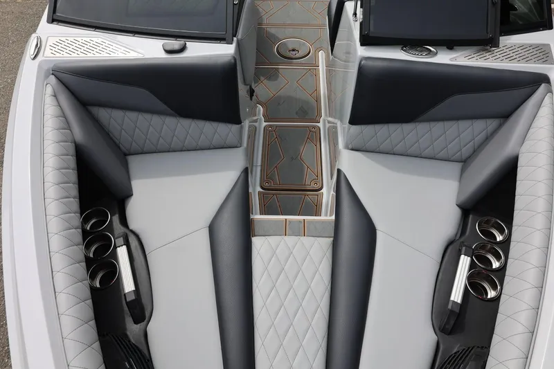 Slide: The Image of 2025 Tigé Z3 boat interior with luxurious seating and cup holders. - 25