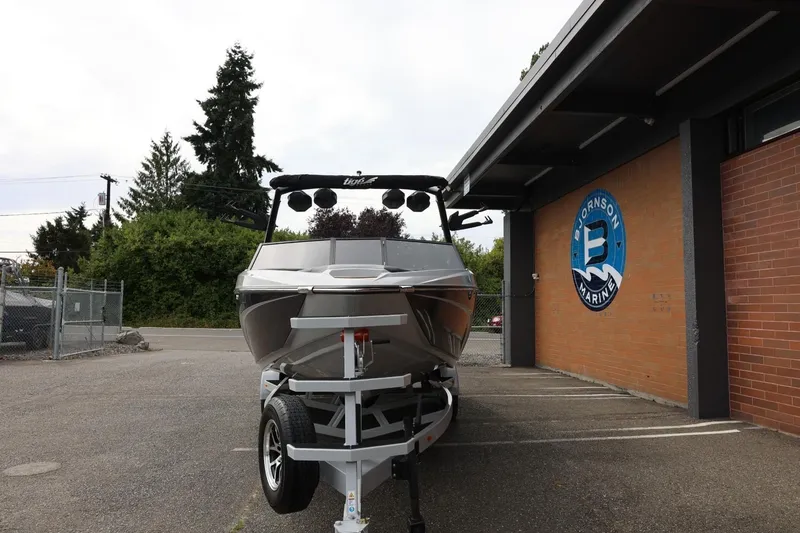 Slide: The Image of 2025 Tigé Z3 boat on trailer outside Bjornson Marine building. - 3