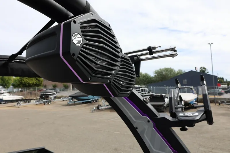Slide: The Image of 2025 Tigé Z3 boat speaker system with sleek design and purple accents. - 31