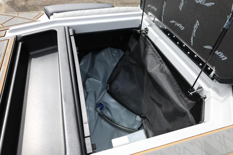 Slide: The Image of 2025 Tigé Z3 boat storage compartment with open lid and visible interior details. - 35