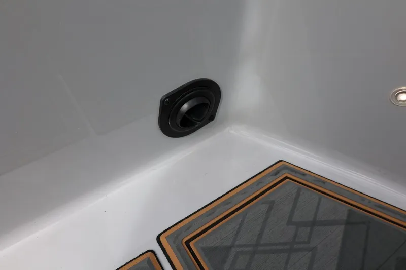 Slide: The Image of Interior detail of 2025 Tigé Z3 boat, featuring a speaker and patterned flooring. - 39