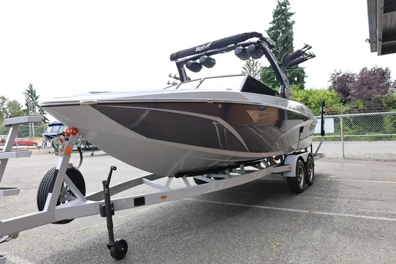 Slide: The Image of 2025 Tigé Z3 boat on trailer, parked outdoors, showcasing sleek design and modern features. - 4