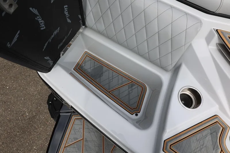Slide: The Image of 2025 Tigé Z3 boat interior with quilted seating and stylish flooring design. - 42