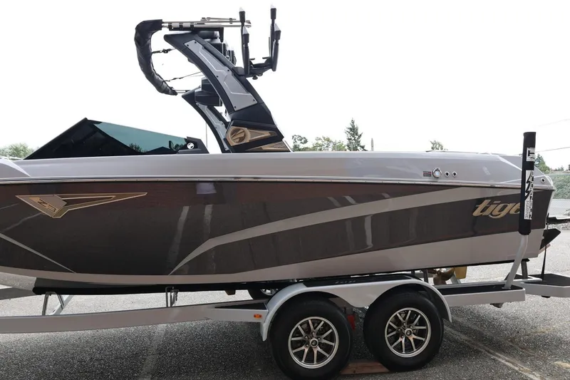 Slide: The Image of 2025 Tigé Z3 boat on trailer, sleek design, gray and black color scheme. - 5