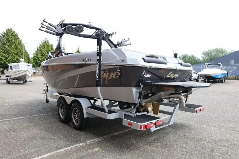Slide: The Image of 2025 Tigé Z3 boat on trailer in parking lot, rear view. - 6