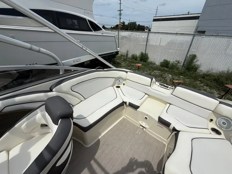 Slide: The Image of 2014 Yamaha Boats 242 Limited S interior with spacious seating and modern design. - 11