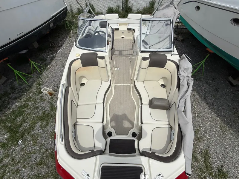 Slide: The Image of 2014 Yamaha Boats 242 Limited S interior with spacious seating and open deck layout. - 18