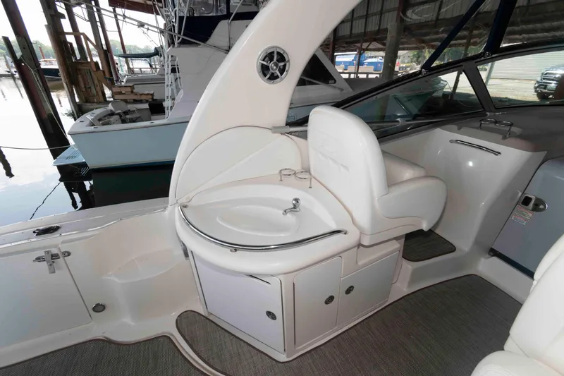 Slide: The Image of 2004 Sea Ray 340 Sundancer helm with dual seats and advanced navigation controls. - 11