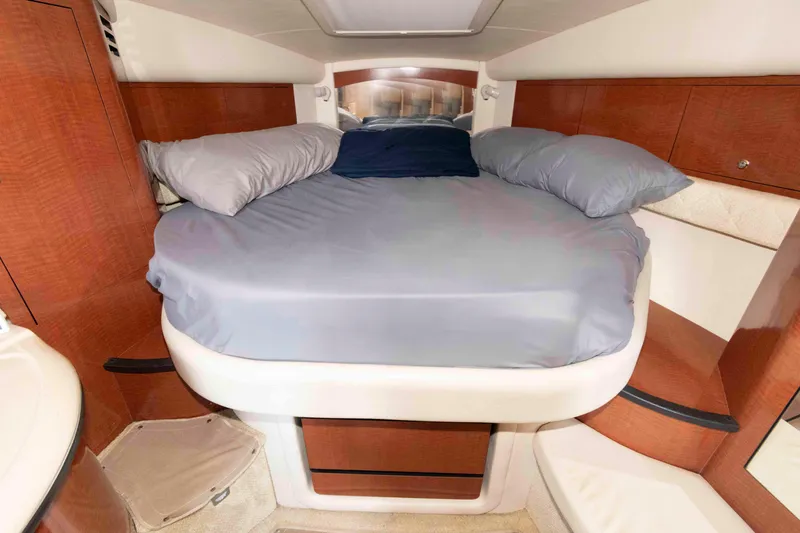 Slide: The Image of 2004 Sea Ray 340 Sundancer cockpit with plush seating and marina view. - 15