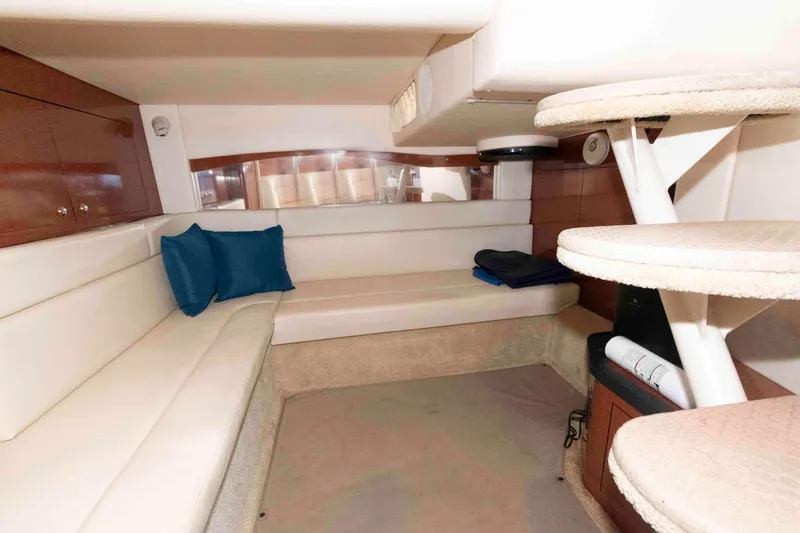 Slide: The Image of Interior of 2004 Sea Ray 340 Sundancer yacht with plush seating and modern design. - 22