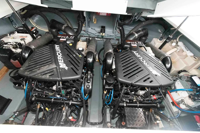 Slide: The Image of Engine room of 2004 Sea Ray 340 Sundancer with twin Mercury engines. - 24