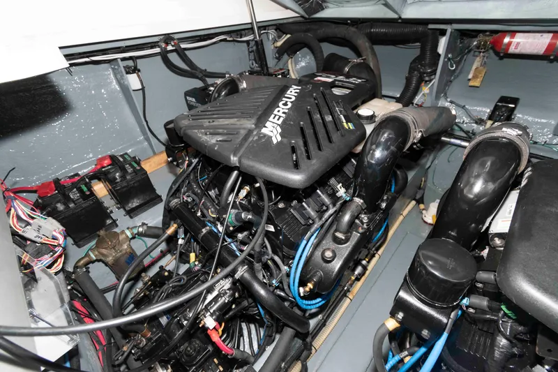 Slide: The Image of Engine compartment of a 2004 Sea Ray 340 Sundancer with Mercury engine components. - 26