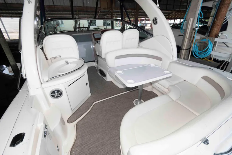 Slide: The Image of 2004 Sea Ray 340 Sundancer cruising on calm waters under clear skies. - 3