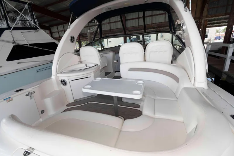 Slide: The Image of 2004 Sea Ray 340 Sundancer docked in a covered marina. - 4